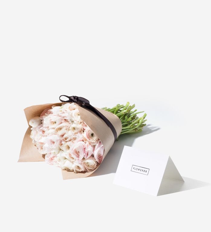 50 stems wrapped in our signature gift wrapping