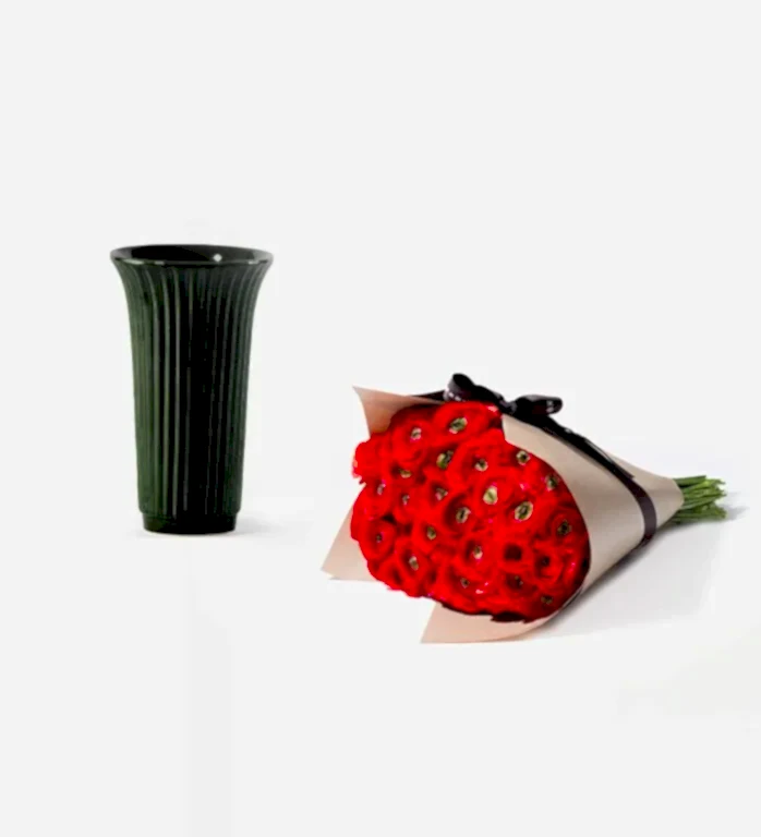 25 Stems of Red Velvet Italian Ranunculus in a 12cm Glazed Emerald Fluted Vase